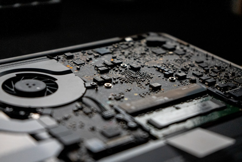 Open laptop hardware being inspected for repair
